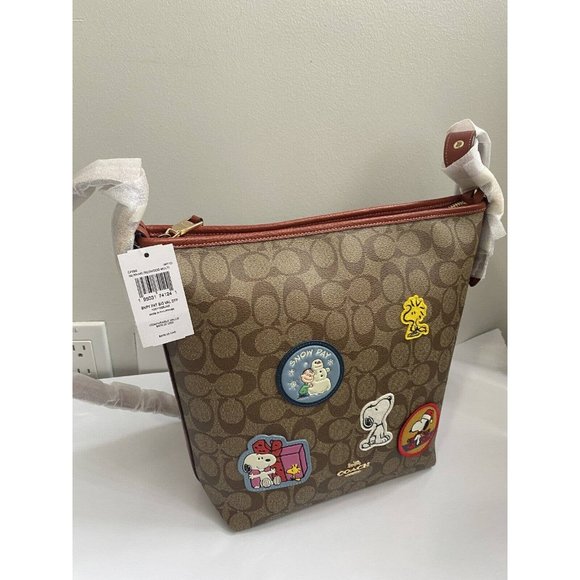 COACH PEANUTS VAL Duffle Signature Canvas Snoopy Winter Patches CF293 NWT - Picture 1 of 6
